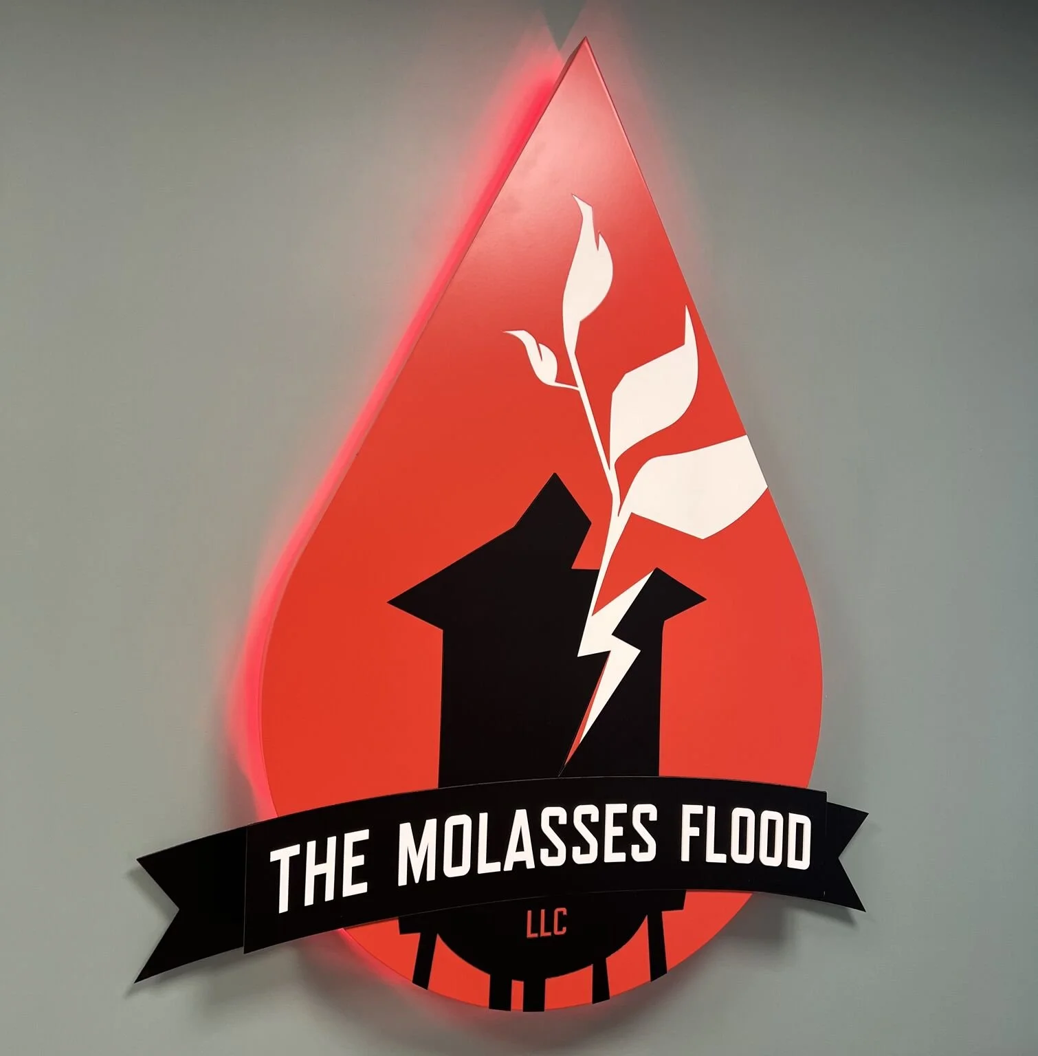 The Molasses Flood studio wall sign.